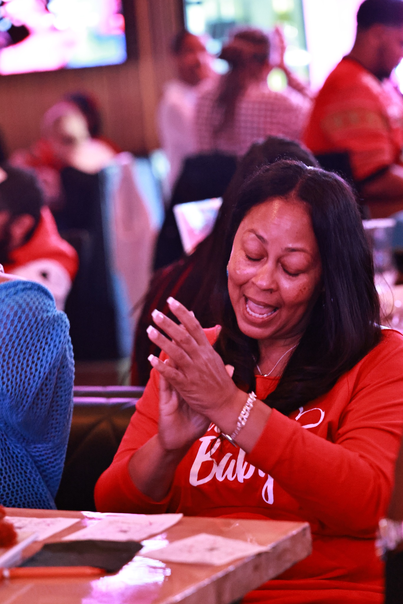 Guest applauding during Rhythm & Bingo