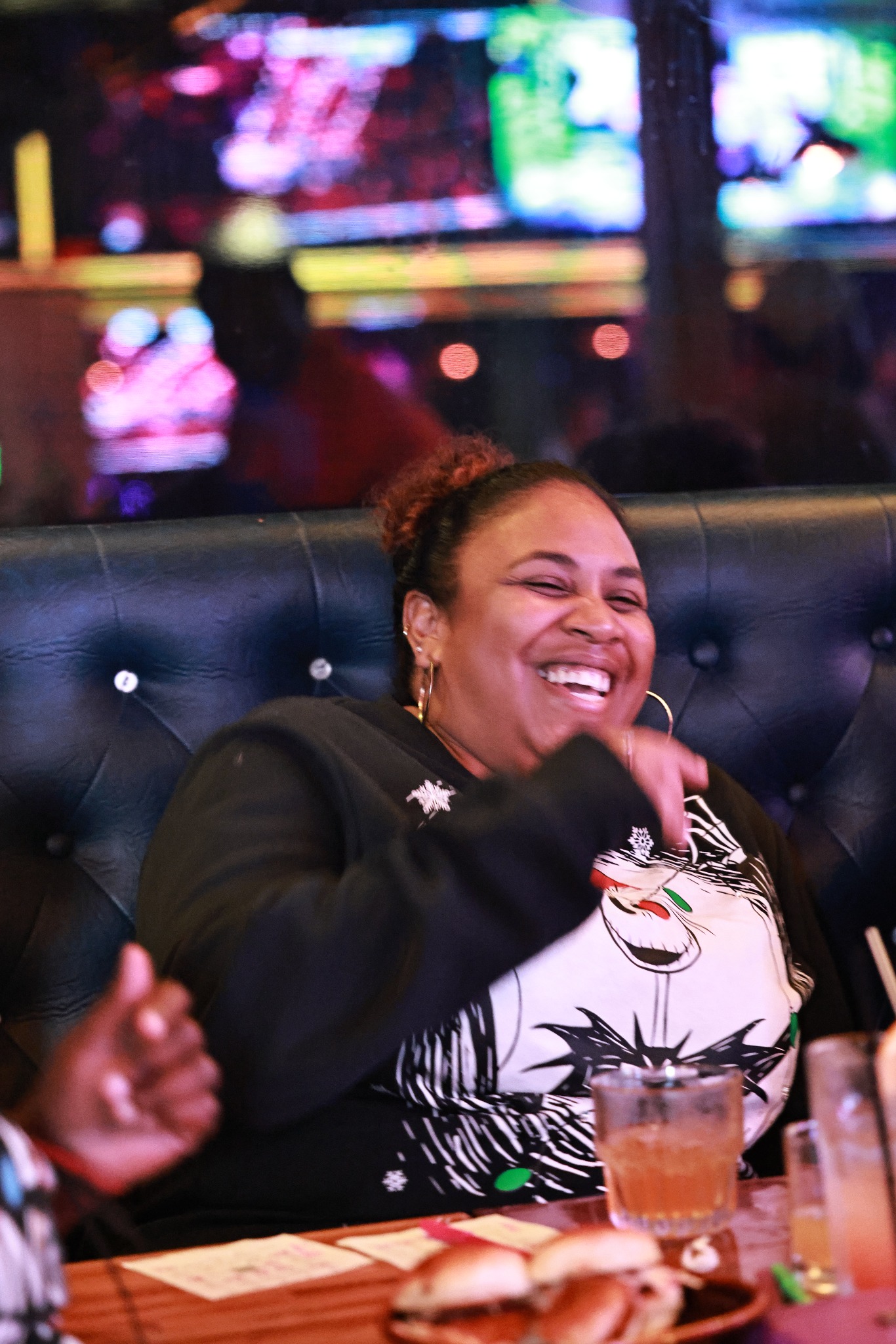 Guest laughing at a Rhythm & Bingo event