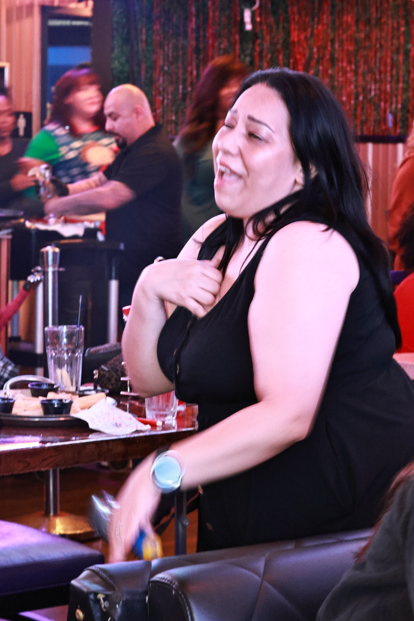 Guest singing along at Rhythm & Bingo